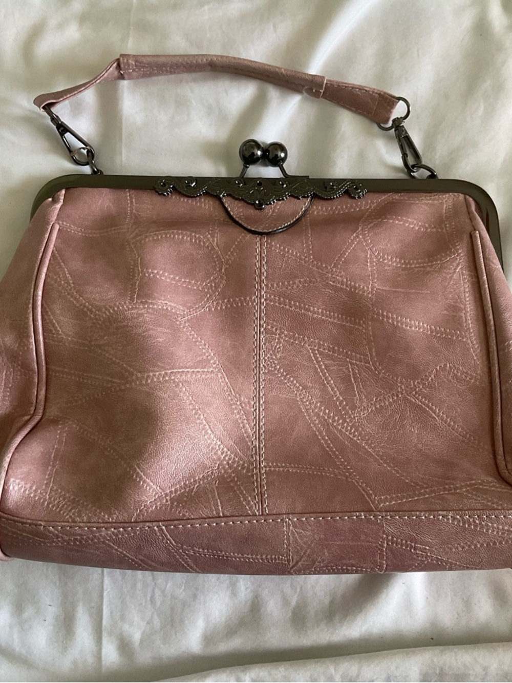 Elegant Pink Frame-Top Wristlet Clutch with Subtle Stitch Detailing